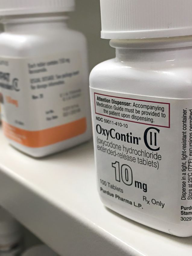 Ogden Utah- July 16, 2016: oxycontin bottle on pharmacy shelf